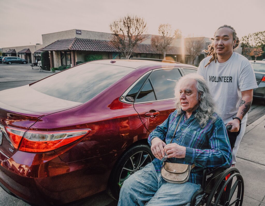 Photo by RODNAE Productions: https://www.pexels.com/photo/a-man-pushing-a-wheelchair-on-the-street-6646777/